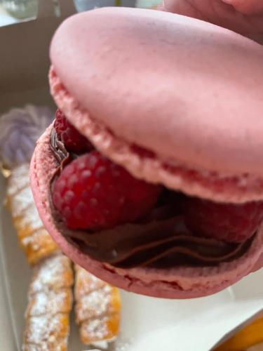 a close up of a cake with strawberries and pastries at Apartmány Nezdice na Šumavě in Nezdice