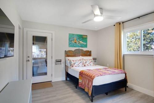 a bedroom with a bed and a window at A Special Retreat on a Mini-Farm -- in SMTX in San Marcos