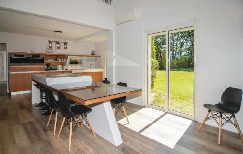 a kitchen with a table and chairs in a room at Pet Friendly Home In Trets With Heated Swimming Pool in Trets