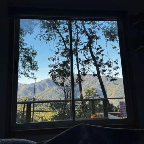 a window with a view of a mountain view at Cabañas el Mirador in Recinto