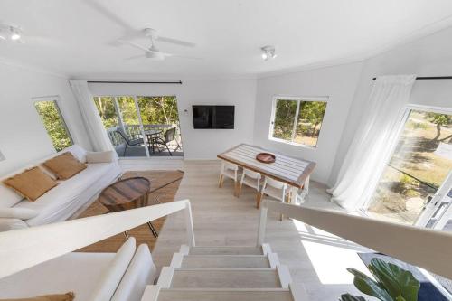 a living room with a couch and a table at (HA2)BEACH VIBES Sunshine beach,100m to Beach, in Sunshine Beach