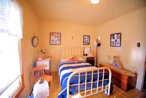 Tempat tidur dalam kamar di La Maison d'Autrefois