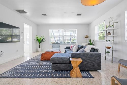 a living room with a couch and a table at Perfect Beach Home For A Family Getaway Wpool! in Miami Beach