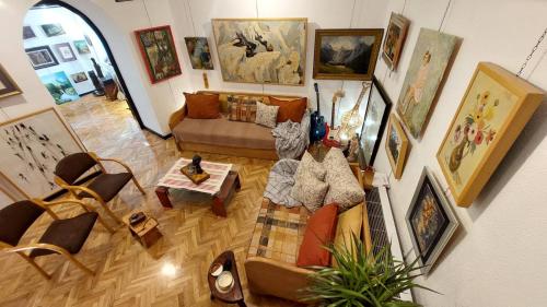 an overhead view of a living room filled with furniture at HeArt of Old Town Guesthouse in Podgorica