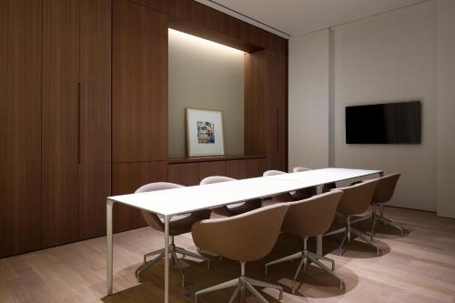 a conference room with a white table and chairs at SEAMARQ HOTEL in Gangneung
