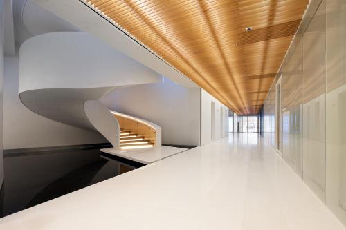 a staircase in a building with a wooden ceiling at SEAMARQ HOTEL in Gangneung