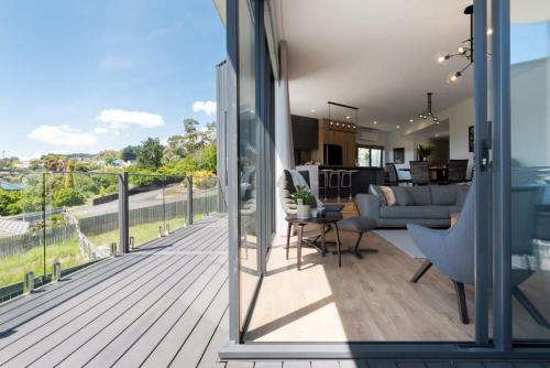 a balcony with a view of a living room at Impressively Spacious Modern & Convenient in Newstead