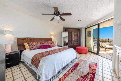 a bedroom with a bed and a ceiling fan at Terrasol Elite Premium Vacation Rentals in Cabo San Lucas