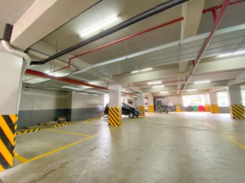 an empty parking garage with a car parked in it at 217 Bonifacio Residences in Baguio