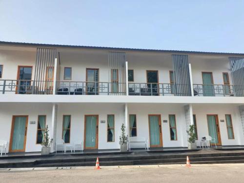 a large building with orange cones in front of it at RINA Poolvilla (รินะ พูลวิลล่า) in Hat Yai