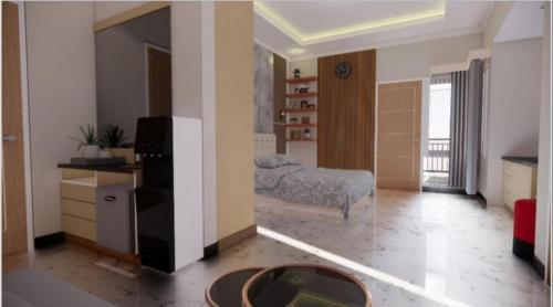 a room with a kitchen and a bed in it at Sumarsi Homestay Mitra RedDoorz in Demangan