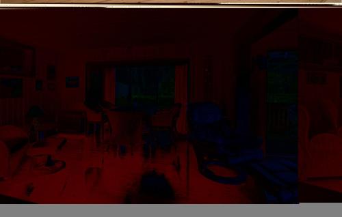 una camera buia con sedie e finestra di Holiday Home Ebeltoft With Fireplace I a Ebeltoft