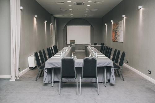 a conference room with a long table and chairs at Hotel Zenit Budapest Palace in Budapest