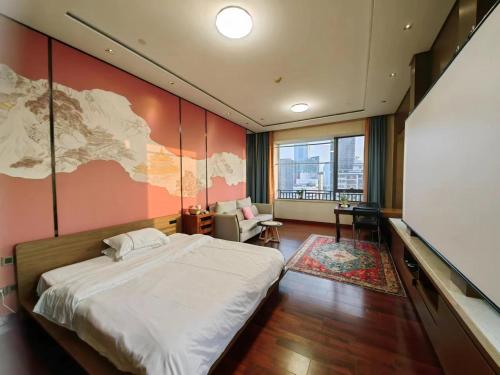 a bedroom with a bed and a map on the wall at 邻致公寓东站中汇店 in Guangzhou