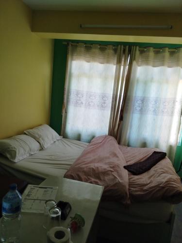 Ένα ή περισσότερα κρεβάτια σε δωμάτιο στο Godawari villa guest house