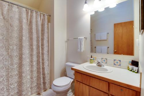 a bathroom with a toilet and a sink and a shower at Forest Haven in Sisters