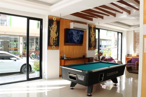 a living room with a pool table in it at Diamond Crown in Patong Beach