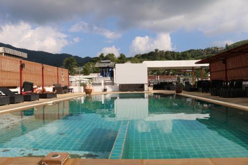 a large swimming pool on top of a building at Diamond Crown in Patong Beach