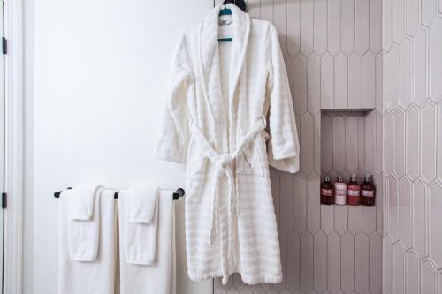 a robe and towels hanging on a rack in a bathroom at lovely 1-bedroom w/parking at Coal Harbour in Vancouver