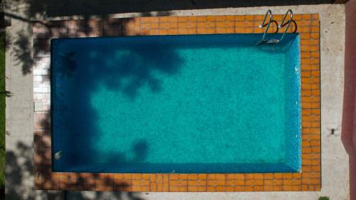 a swimming pool on the side of a building at Silver springs Homestay Chickmagalur in Chikmagalūr