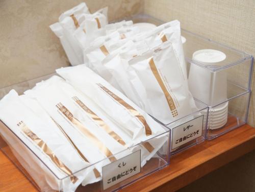 a group of white napkins sitting on a table at ハタラコリビング 秩父サテライト in Chichibu