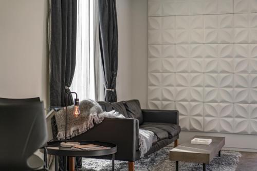 a living room with a couch and a table at Dunedin Central Luxe Pad in Dunedin