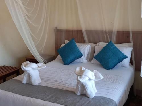 Кровать или кровати в номере Cutty Sark Lodge
