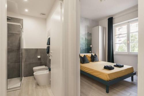 a bedroom with a bed and a shower and a toilet at La Casina 348 in Rome