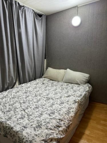 Ένα ή περισσότερα κρεβάτια σε δωμάτιο στο G Mini Hotel Dongdaemun