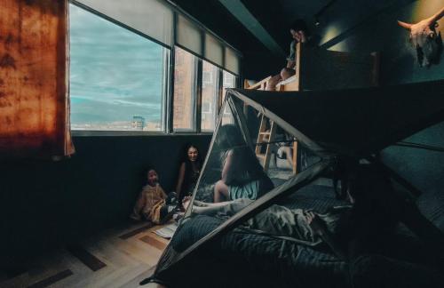 a group of people sitting in a room looking out the window at Amouter HC in Hengchun