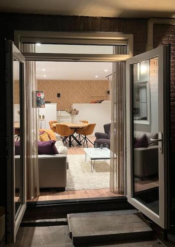 a living room with a view of a dining room at Volendam Lakeside Retreat - 20 min from Amsterdam in Volendam