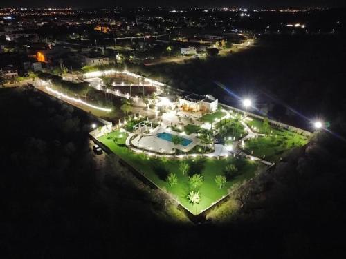 an aerial view of a park at night with lights at Villa Anna - Suites & Events in Specchia