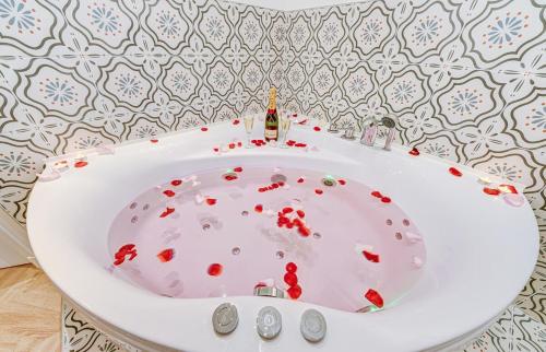 a bathroom with a white sink with blood on it at Boudoir - Spa & Chateau Fontainebleau in Avon