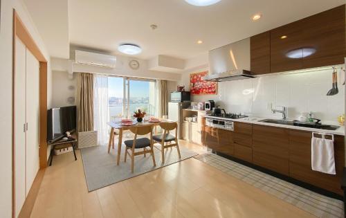 a kitchen with a table and a dining room at 安楽途 in Tokyo