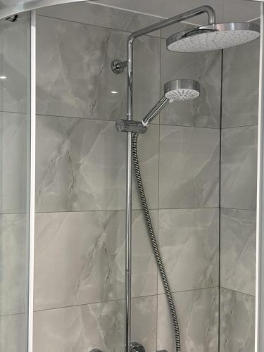 a shower with a glass door in a bathroom at Cozy 2 Bed Property in High Wycombe Tn in High Wycombe