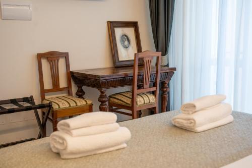 a room with a table with towels on a counter at Residenza degli Speziali in Florence