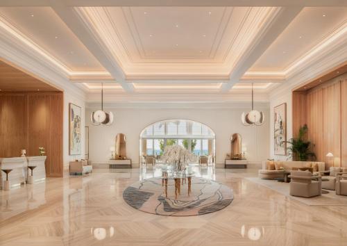 a rendering of a lobby with a table in the middle at Four Seasons Resort and Residences at The Pearl - Qatar in Doha