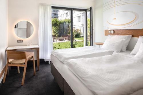 Postel nebo postele na pokoji v ubytování Hotel Golf Prague