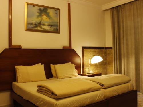 Postel nebo postele na pokoji v ubytování Viccini Suites
