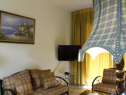 TV a/nebo společenská místnost v ubytování Viccini Suites