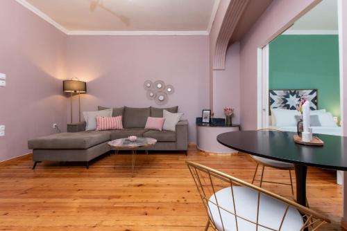 a living room with a couch and a table at Houseloft White Tower Collection in Thessaloniki