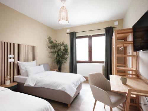 Ένα ή περισσότερα κρεβάτια σε δωμάτιο στο Moderne Apartments nähe VW - Conti