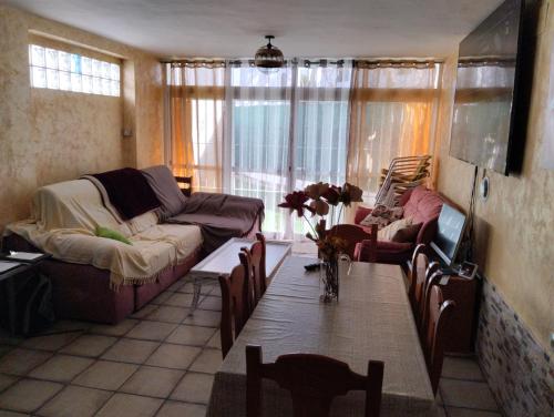 a living room with a couch and a table at Playa-Pinares-Felicidad in Isla Cristina