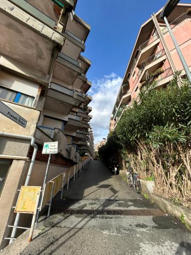 an empty street next to a tall building at Escape Express by PortofinoVacanze in Rapallo