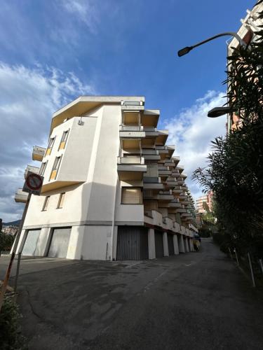 a white building with balconies on the side of it at Escape Express by PortofinoVacanze in Rapallo