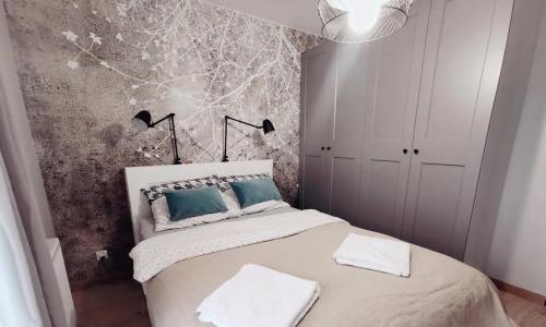 Ένα ή περισσότερα κρεβάτια σε δωμάτιο στο Loft przy Wiśniowej