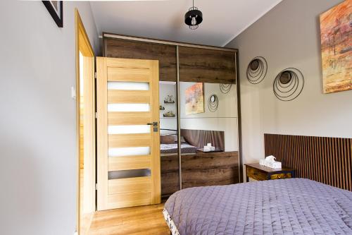 Postel nebo postele na pokoji v ubytování Apartament Tatarska Przemyśl
