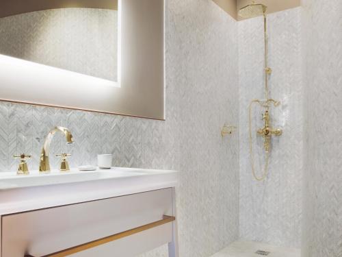 a bathroom with a sink and a shower at Maison Bréguet in Paris
