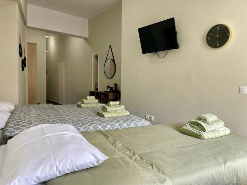 Postel nebo postele na pokoji v ubytování Sea Side Rooms