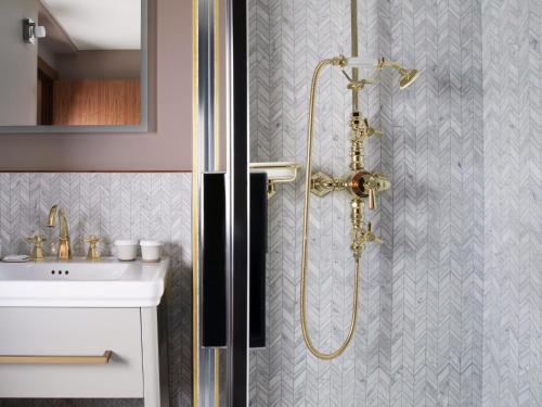 a bathroom with a shower and a sink at Maison Bréguet in Paris